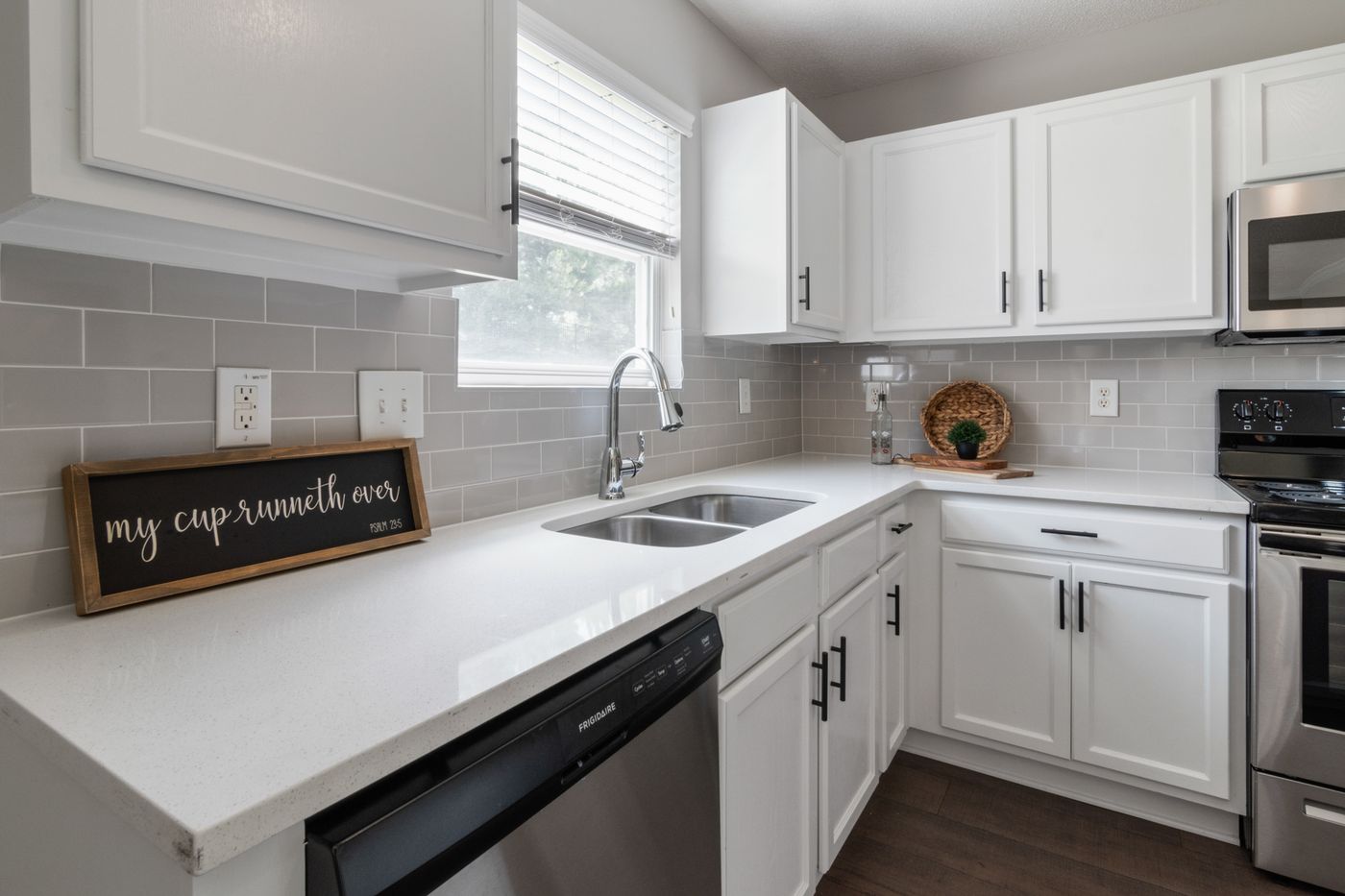 Bright kitchen with smooth white refinished cabinets