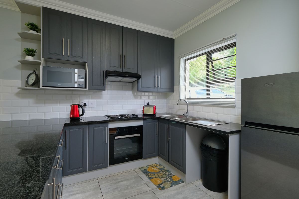 Kitchen island and built-ins refinished in a contrasting color