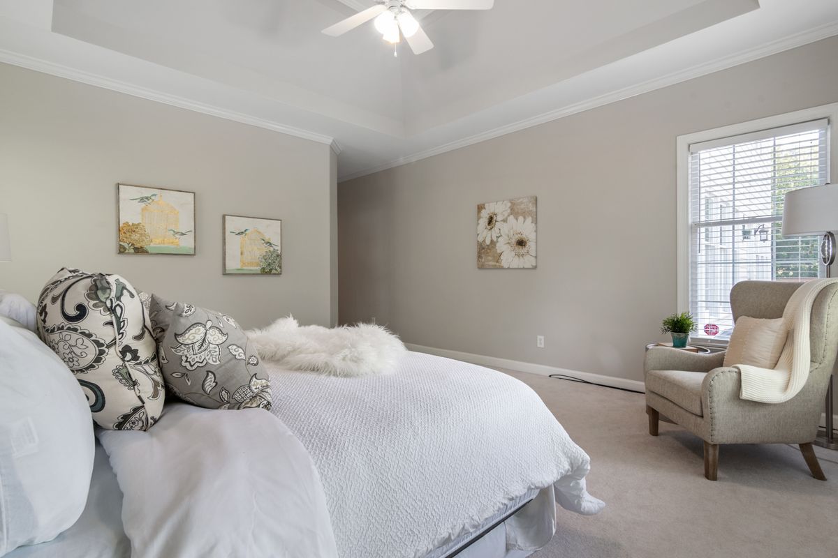Finished primary suite with crisp trim and painted walls